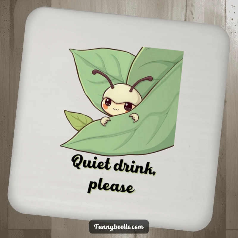 Funny drink coaster featuring a shy beetle peeking from behind a leaf, adding gentle humor and protecting surfaces with quiet charm.