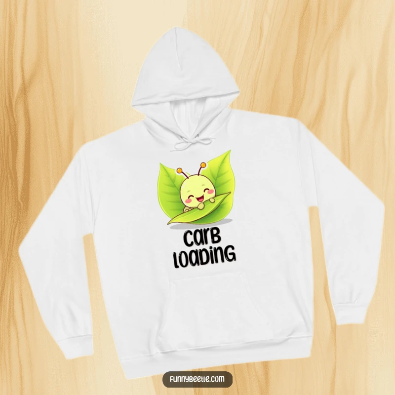 Funny hoodie featuring a cheerful caterpillar character enjoying a vibrant green leaf, providing cozy warmth and a touch of playful, food-themed humor.